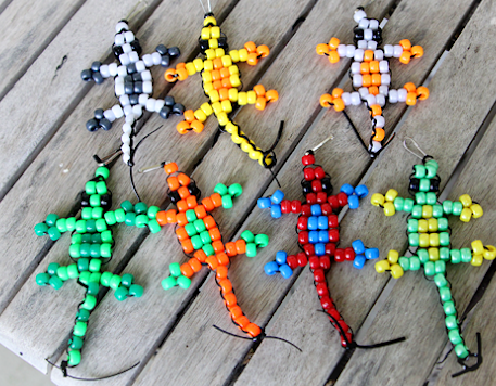 seven lizards made of beads and string